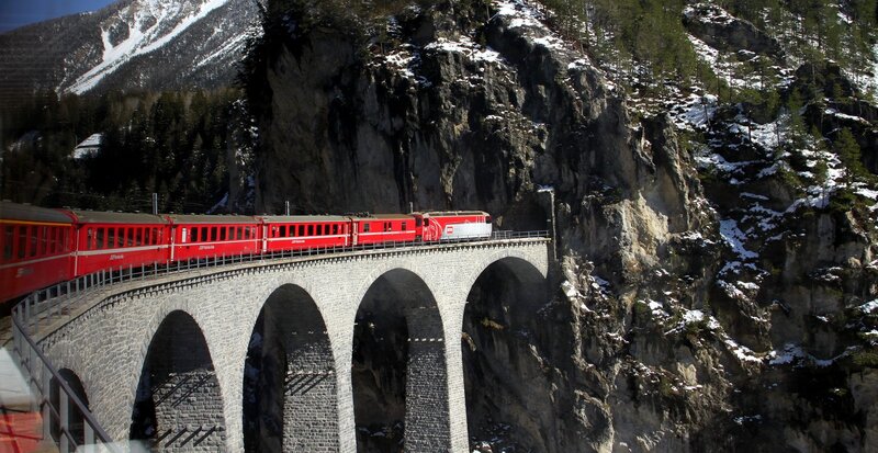 Red Train on Bridge — Dramatic, Winter, Photograph, Mountain, Snow