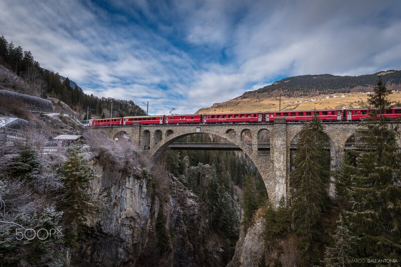 Red Train on Bridge — Dramatic, Winter, Photograph, Mountains