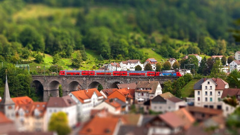 Red Train on Bridge — Green, Serene, Afternoon, Photograph