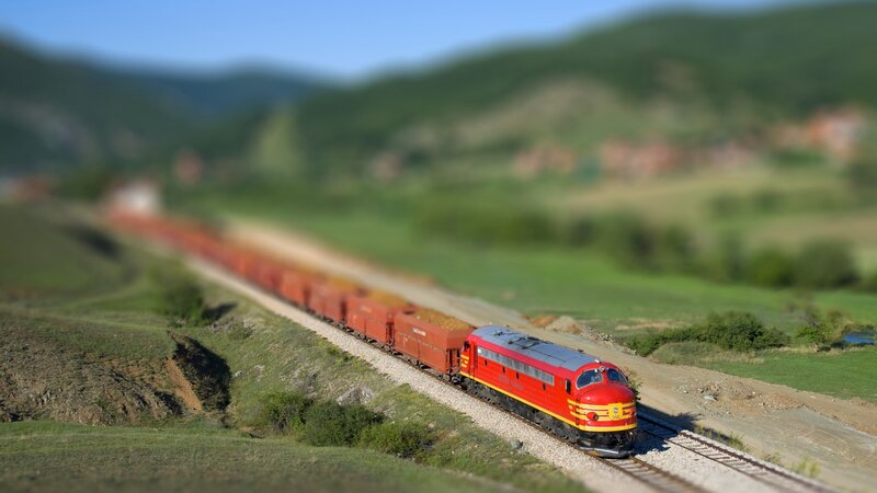 Red Train on Hillside — Serene