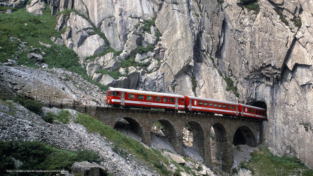 Red train on mountain bridge