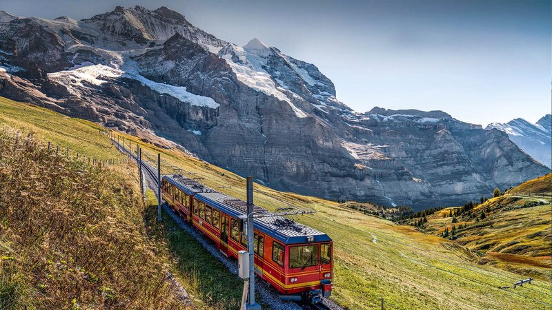 Red Train on Mountain Track