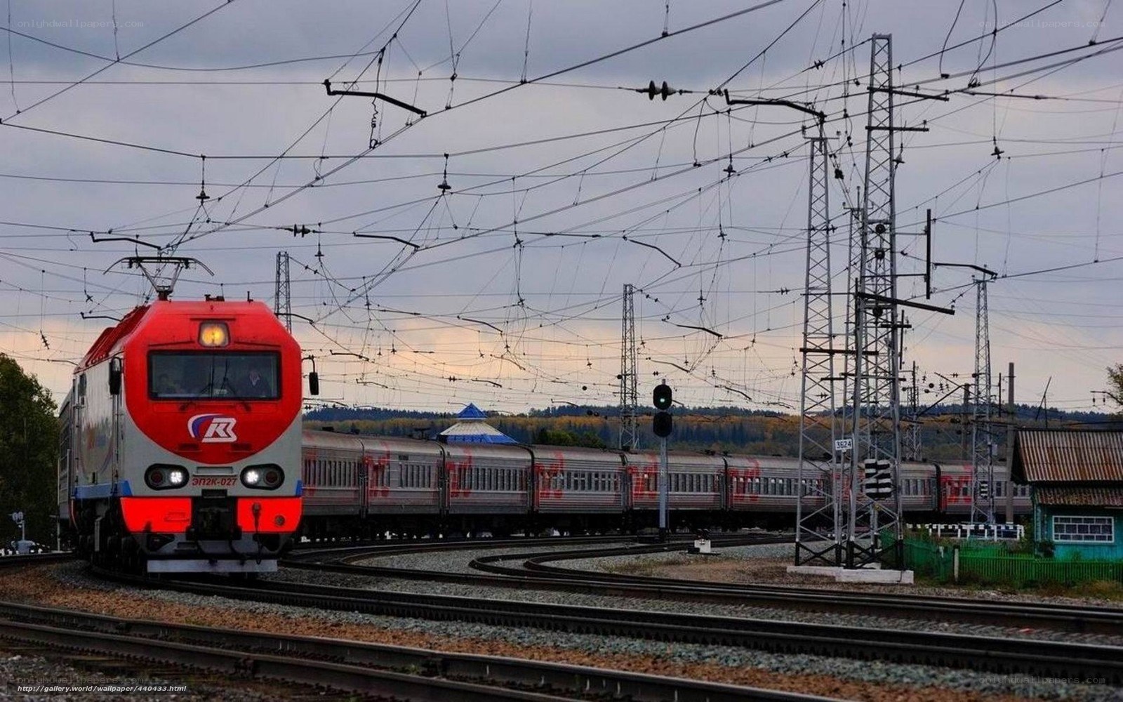 Red train on railway tracks