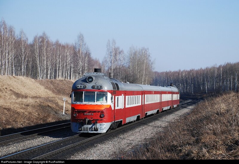 Red train on rural track