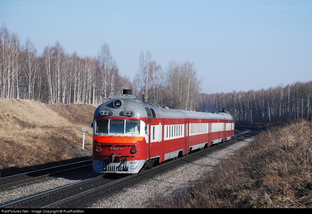 Red train on rural track
