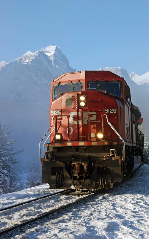 Red Train on Snowy Track