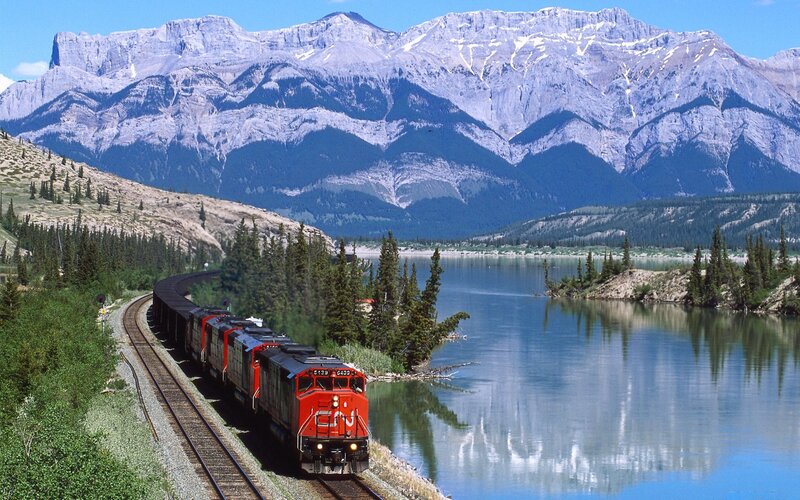 Red Train on Tracks — Blue, Serene, Afternoon