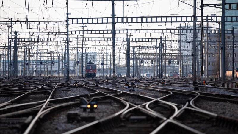 Red Train on Tracks — Gray