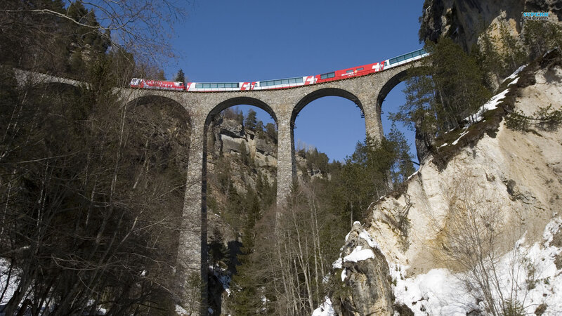 Red Train on Viaduct — Blue, Dramatic