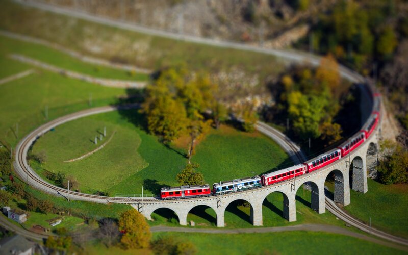Red Train on Viaduct — Serene, Afternoon