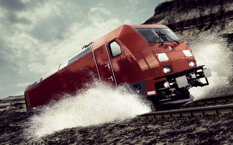 Red train splashing water