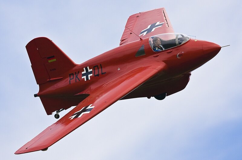 Red training aircraft in flight