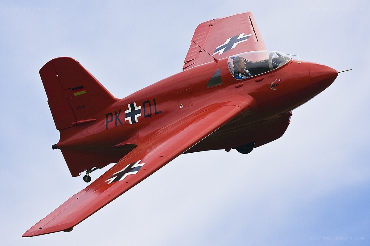 Red training aircraft in flight