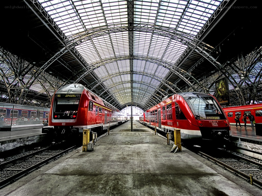 Red trains in a train station