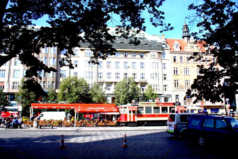 Red Tram in City — Bright