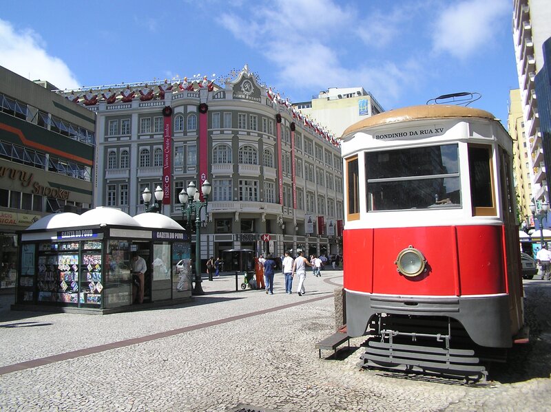 Red tram in city square