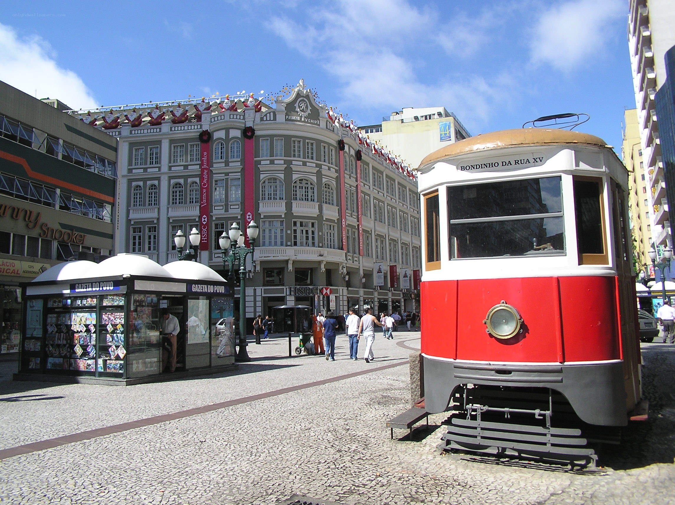 Red tram in city square