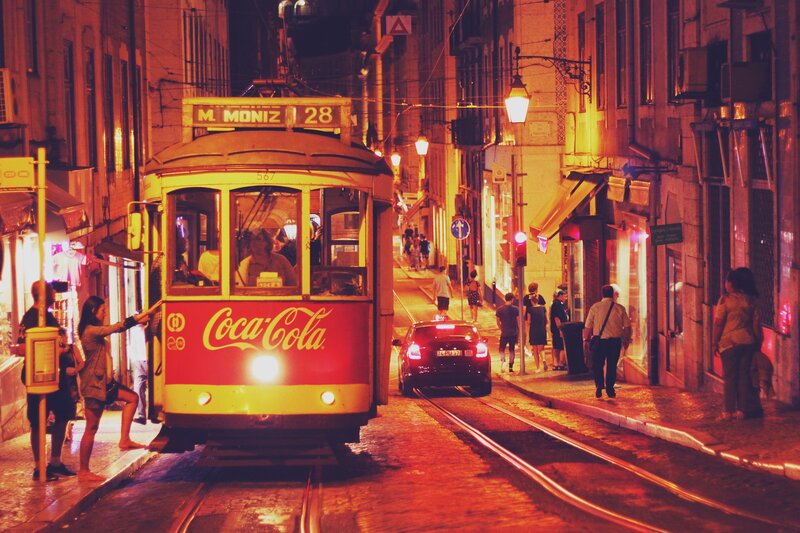 Red Tram on Street — Nocturnal
