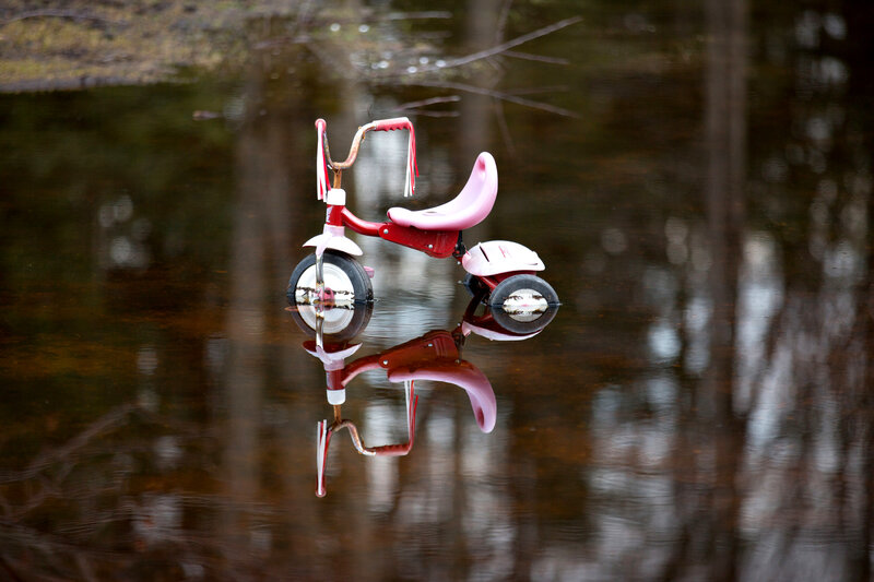 Red Tricycle in Water