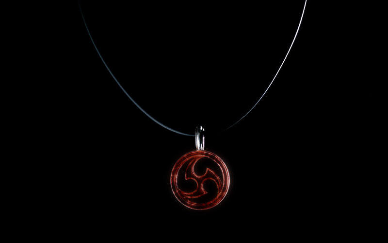 red triskelion pendant