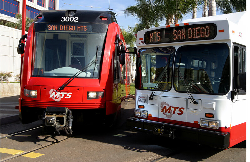 Red Trolley and White Bus