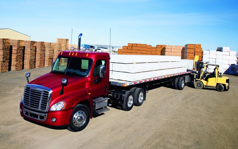 Red truck hauling lumber