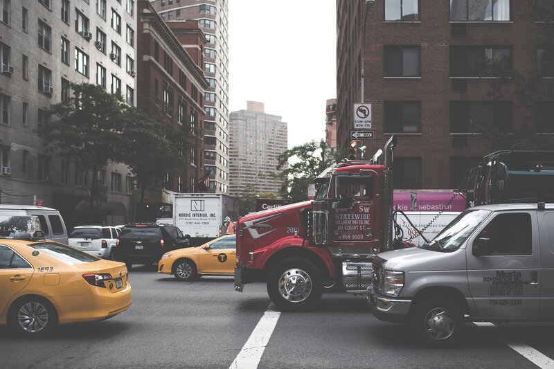 Red Truck in City Traffic