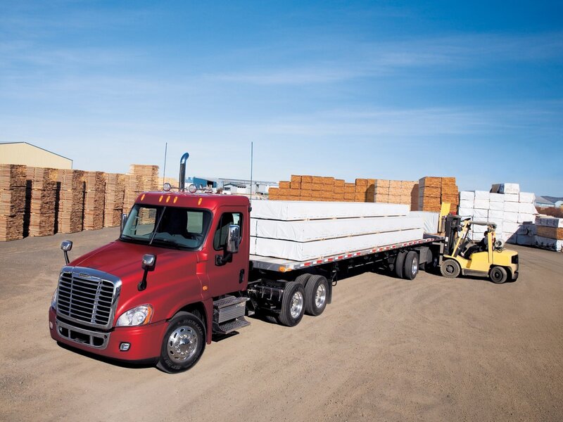 Red truck loading lumber