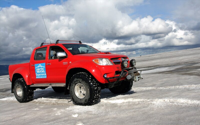 Red truck on icy terrain