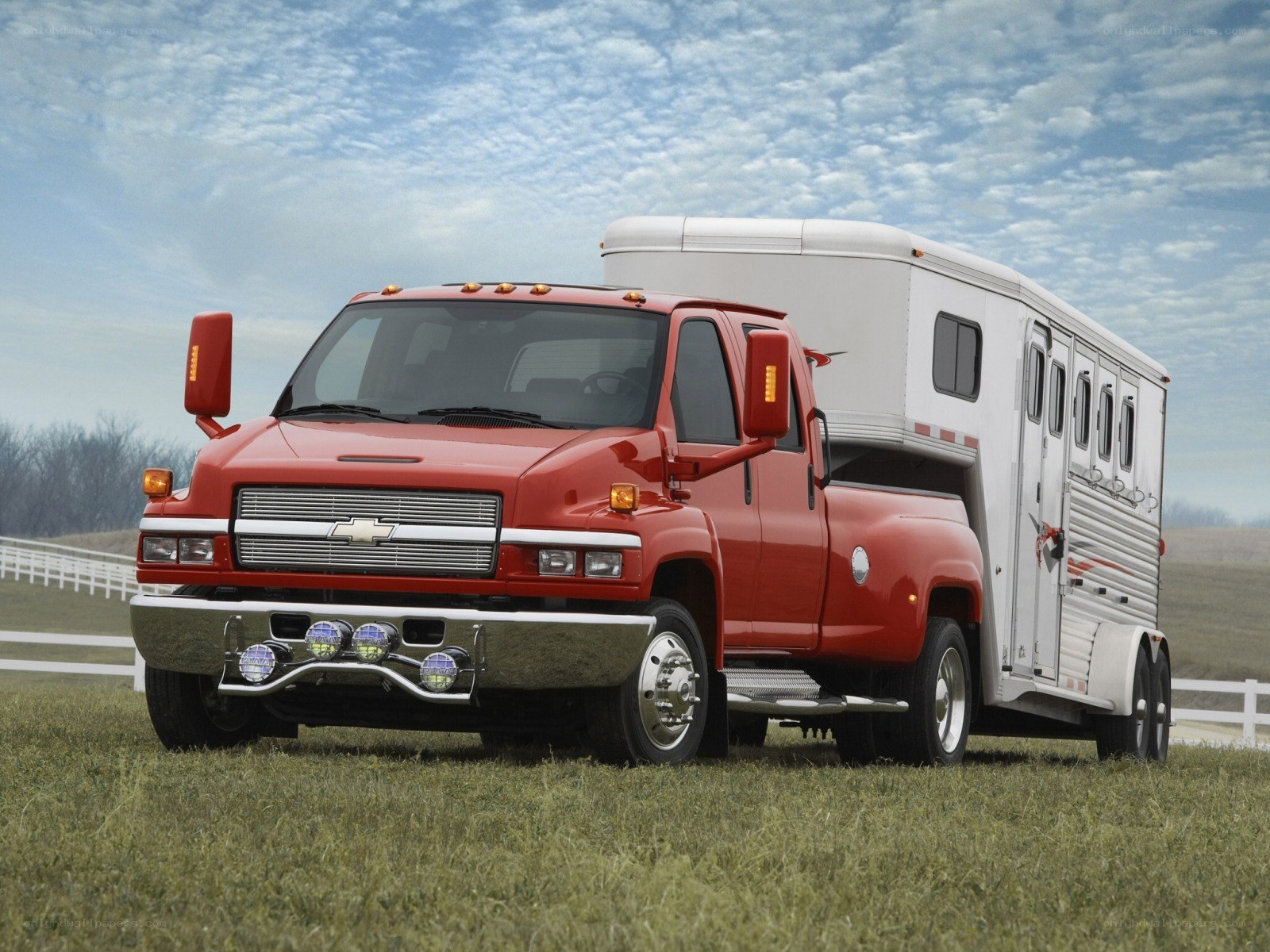 Red truck pulling horse trailer
