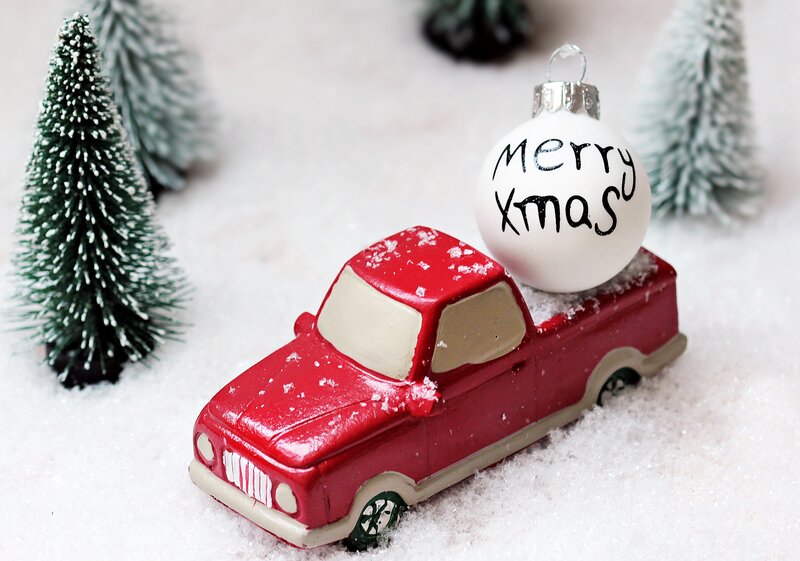 Red truck with Christmas ornament