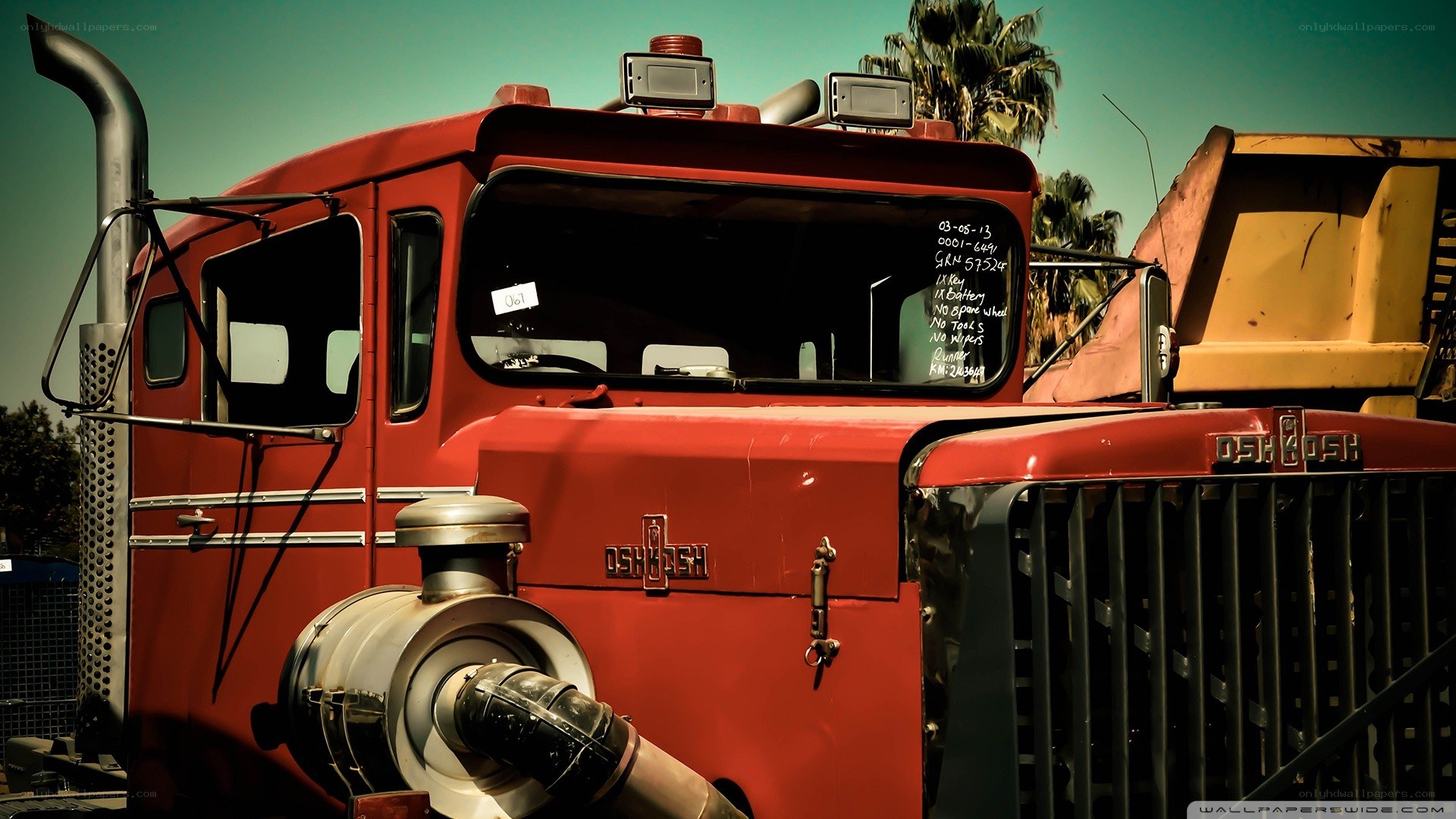 red truck with yellow dump bed
