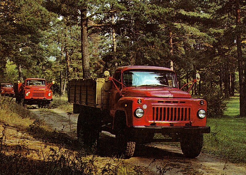Red trucks in forest