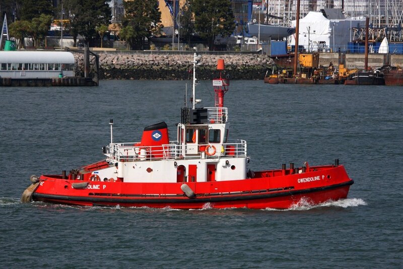 Red tugboat in harbor
