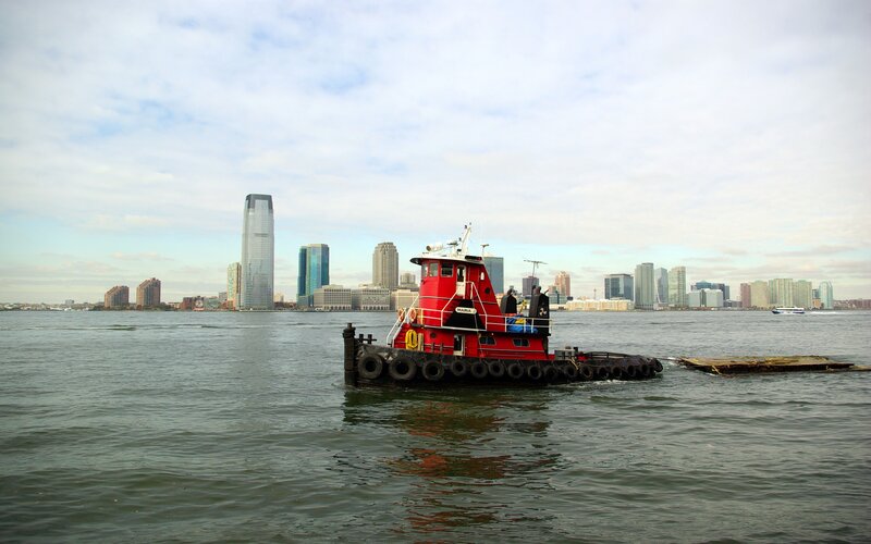 Red Tugboat in Water