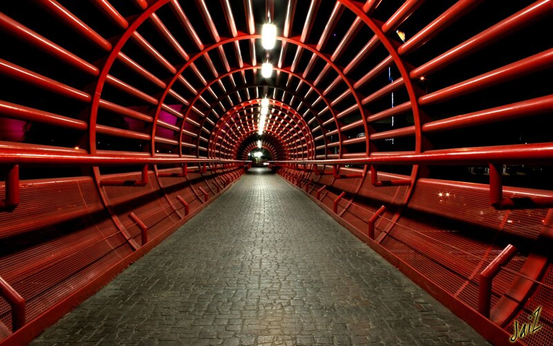 Red tunnel walkway at night