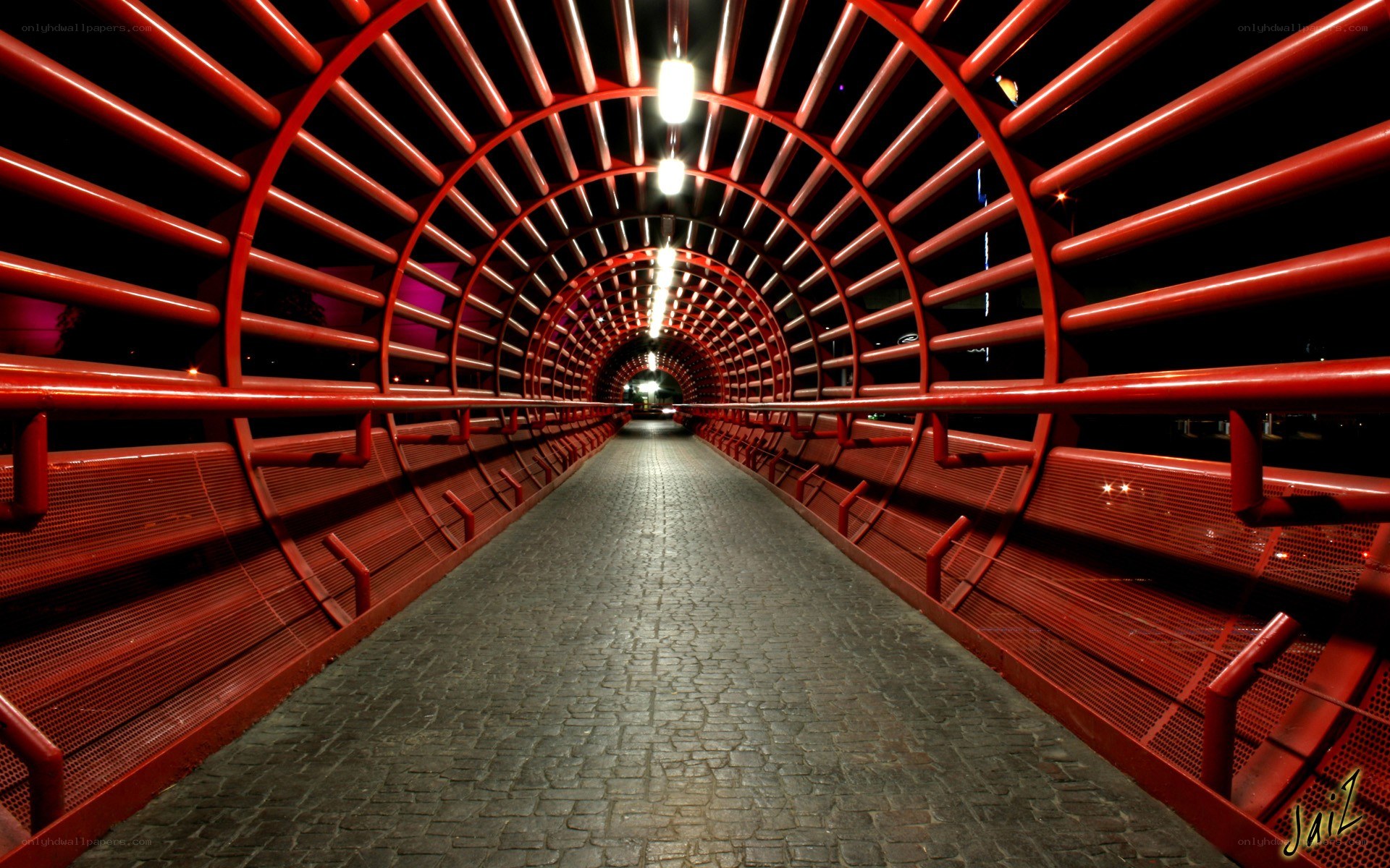 Red tunnel walkway at night