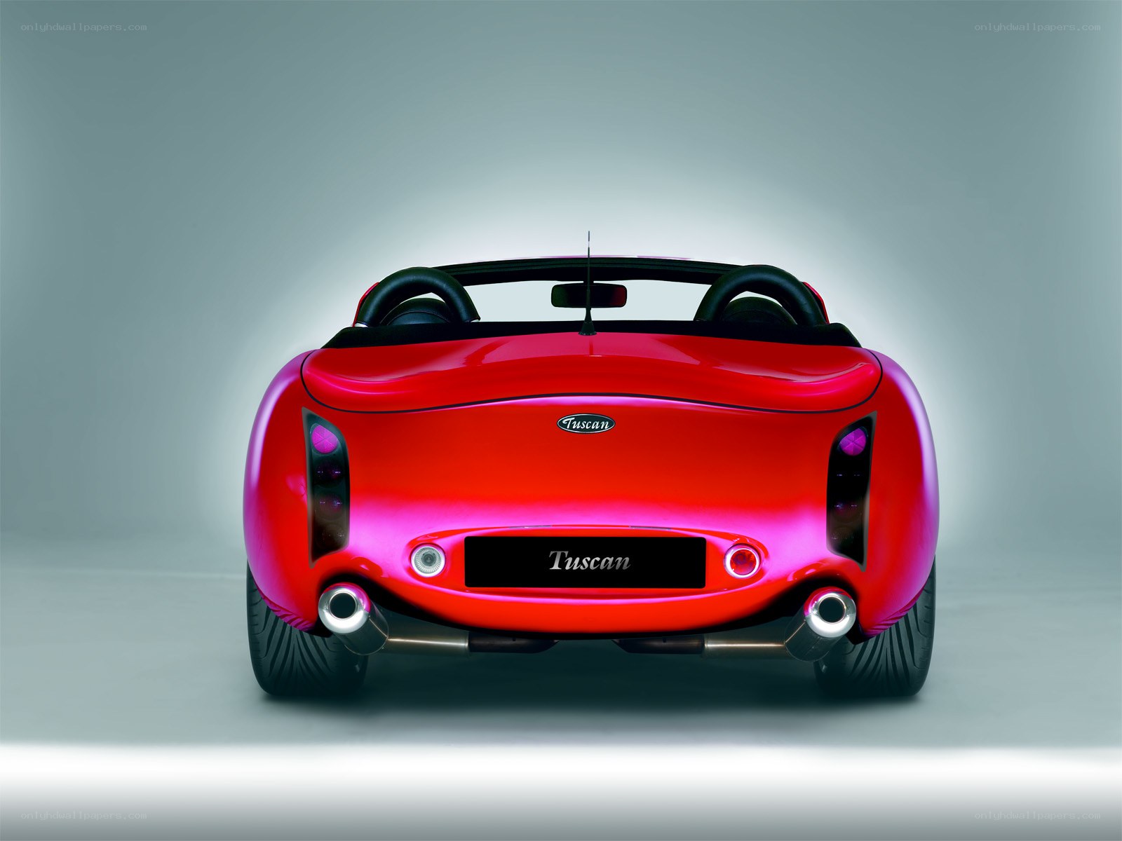 Red Tuscan convertible rear view