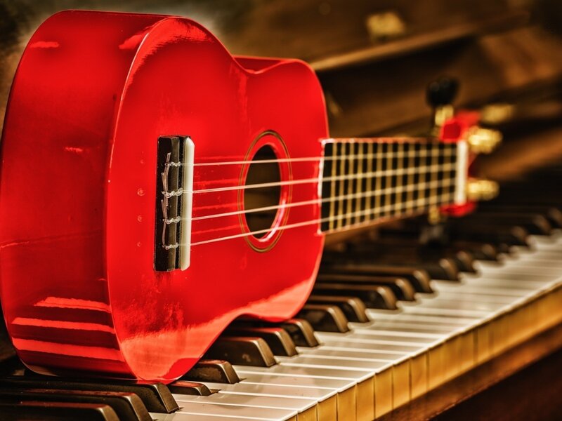 Red Ukulele on Piano