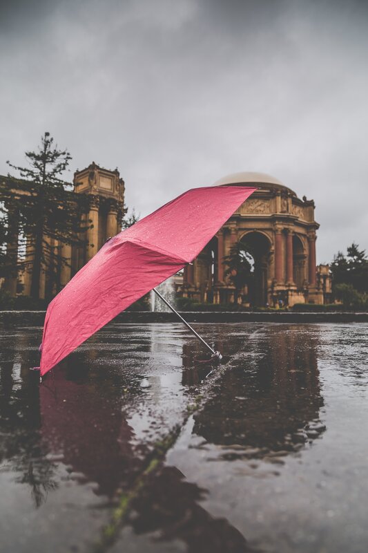 Red Umbrella in Puddle