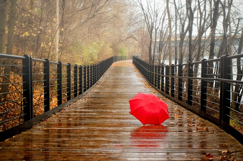 Red Umbrella on Bridge
