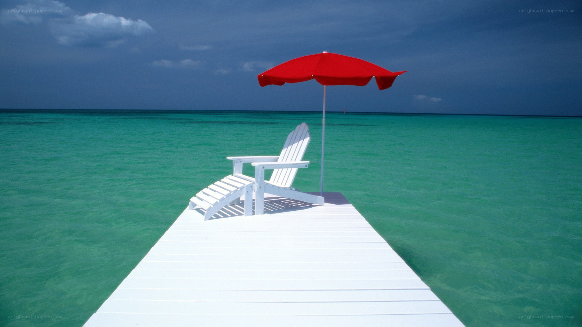 Red umbrella on dock