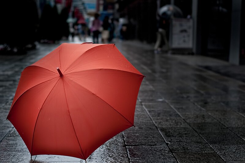Red Umbrella on Pavement — Dreary, Night