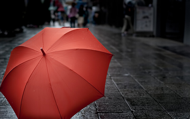 Red Umbrella on Pavement