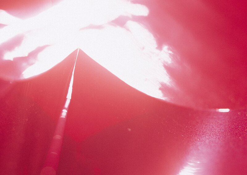 red umbrella under bright light