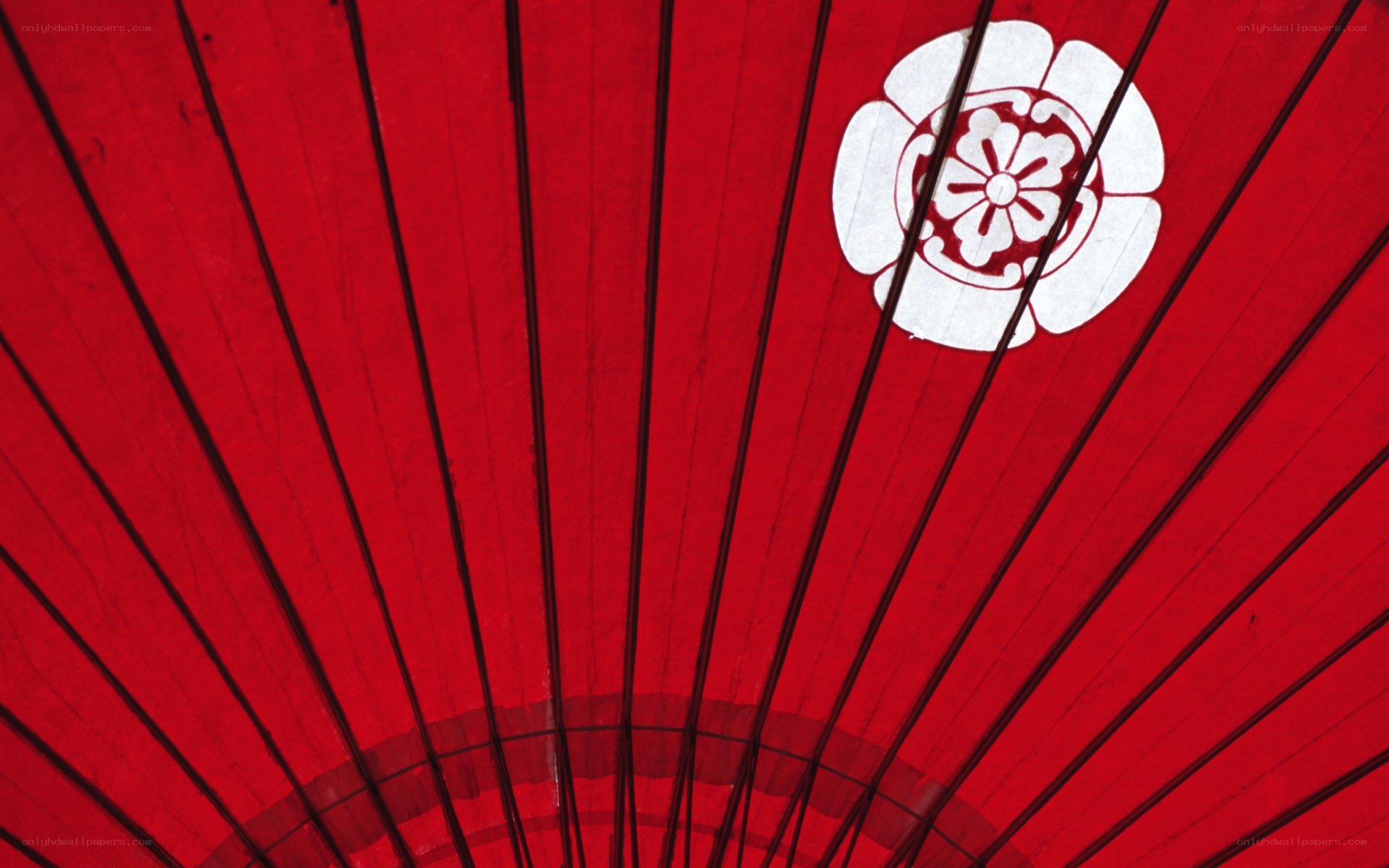 Red umbrella with white emblem