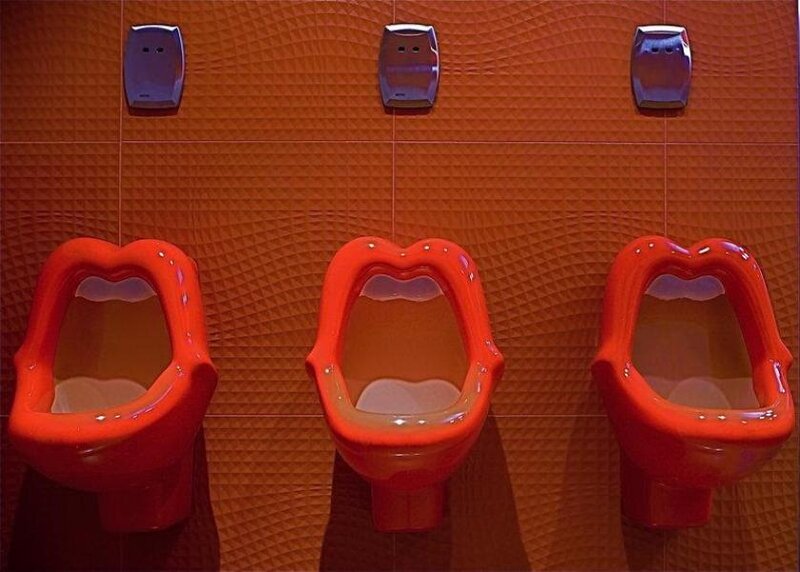 Red Urinals on Wall