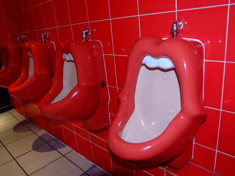 Red urinals shaped like mouths