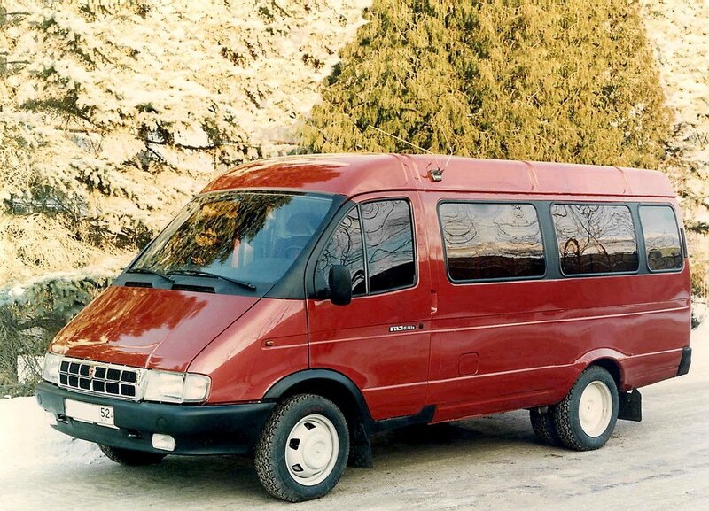 Red van in snowy landscape