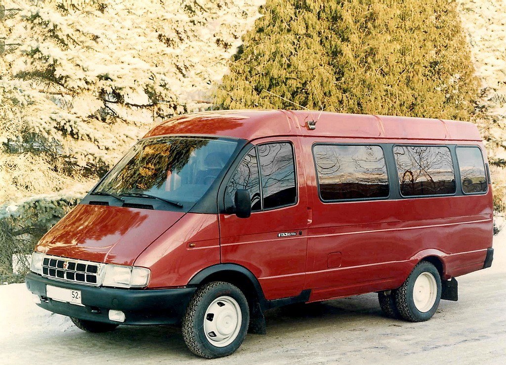 Red van in snowy landscape